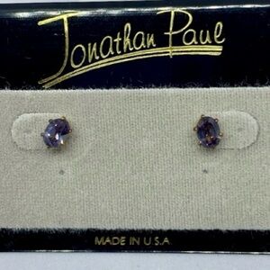 Gold tone purple stone pierced earrings. NWT.